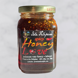 Jar of spicy honey with a label on a light gray background
